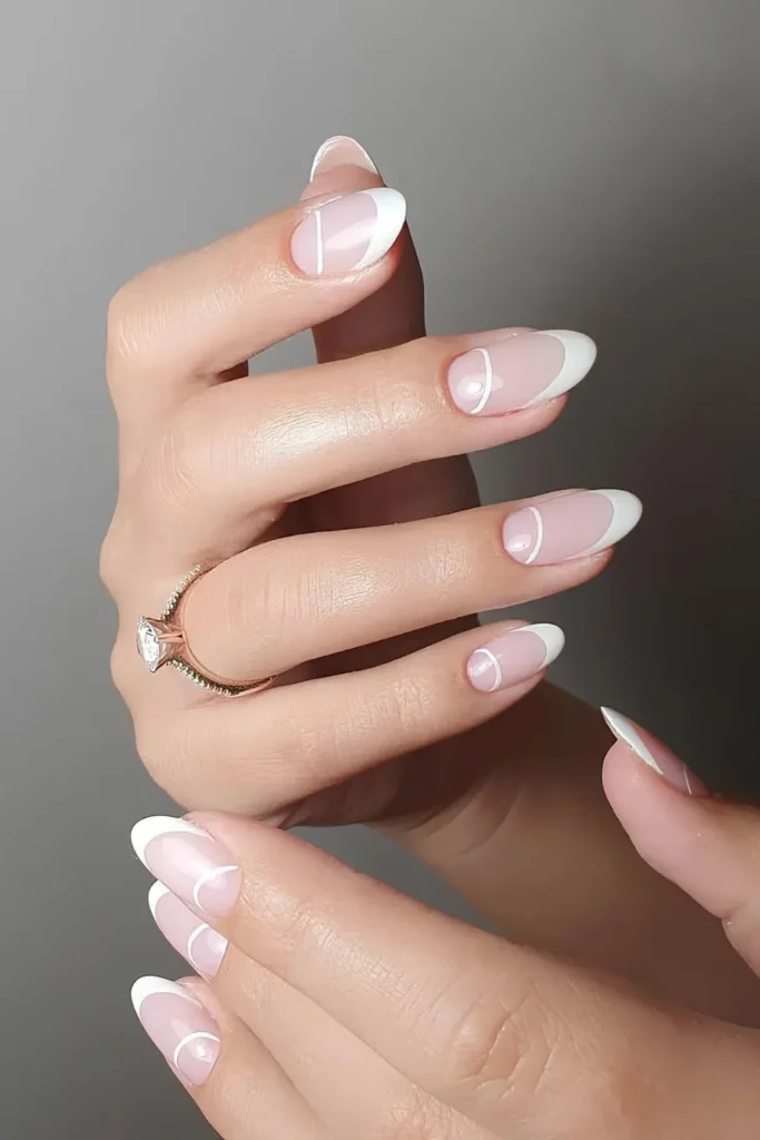 Half-moon outlined French manicure with white tips