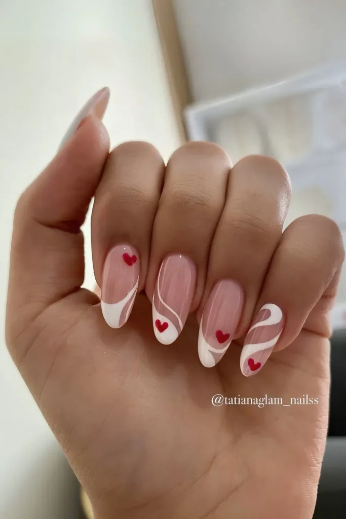 White French tips with hearts and swirly nail art designs