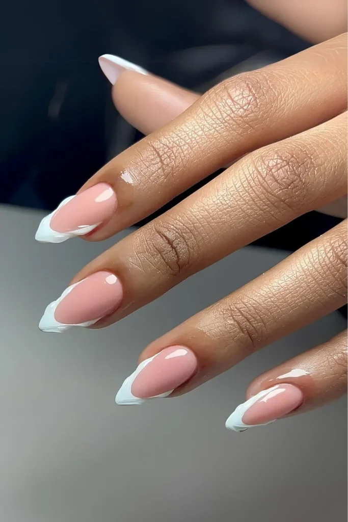 3D French tip nails with raised pearls and bows