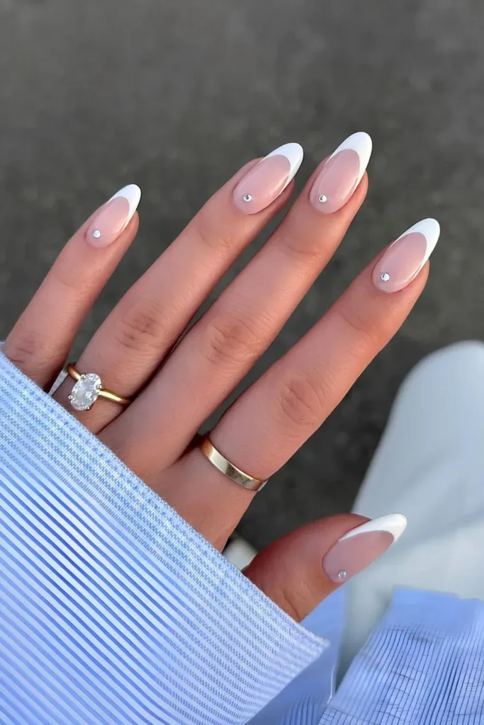 White French manicure with rhinestones along nail line